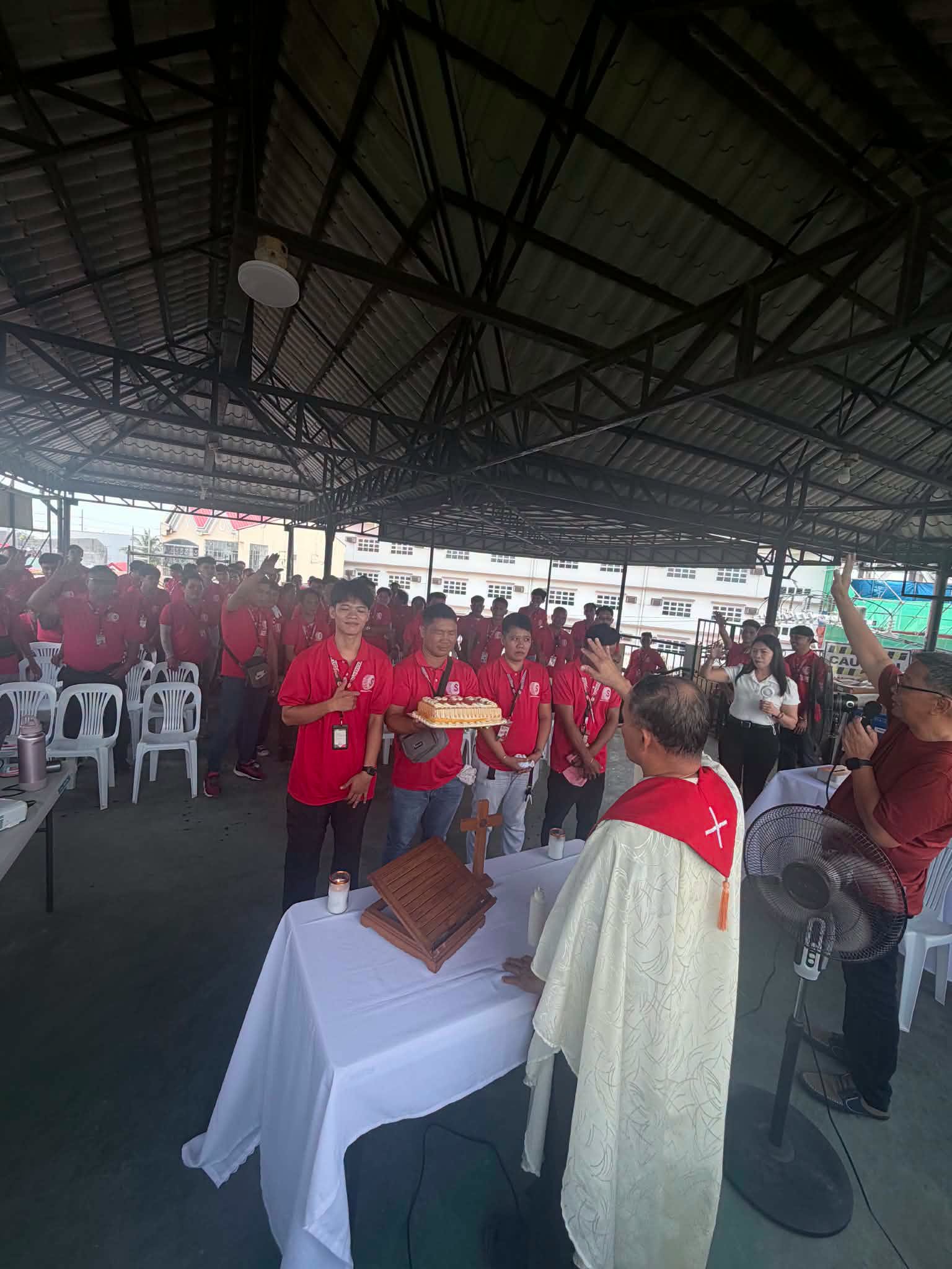 SPEEDels employees attending a company Mass